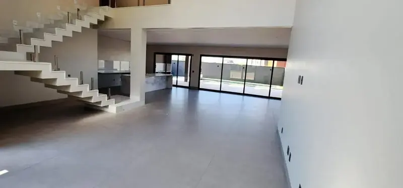 Living integrado à cozinha e à varanda do sobrado no Jardins França, Goiânia